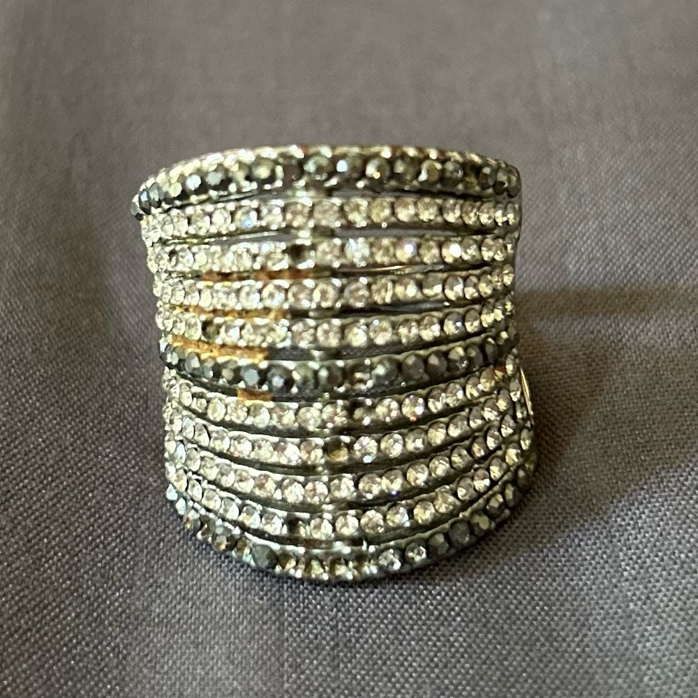 Stylish ring has some missing stones;